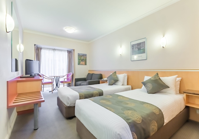 Imagen de la habitación del Hotel The Waverley International. Foto 10