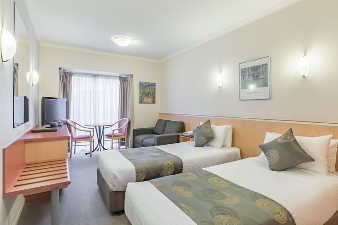 Imagen de la habitación del Hotel The Waverley International. Foto 11