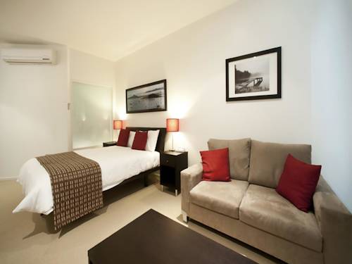 Imagen de la habitación del Hotel The Waves Apartments. Foto 1