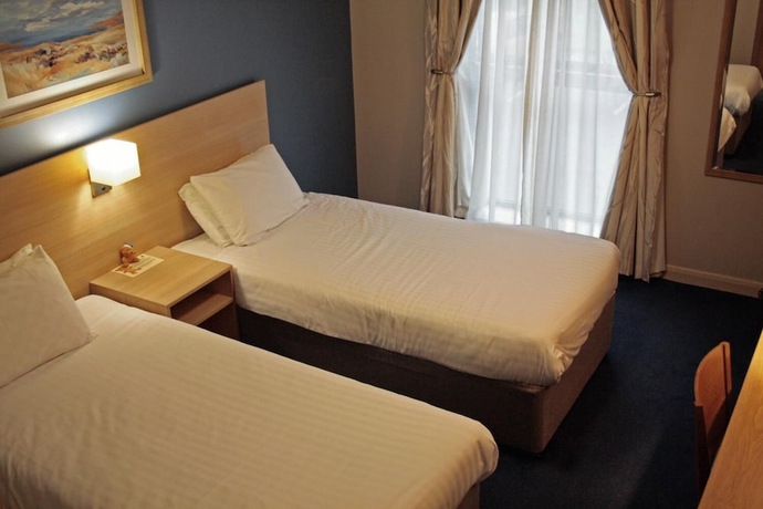 Imagen de la habitación del Hotel The Welcome Inn. Foto 4