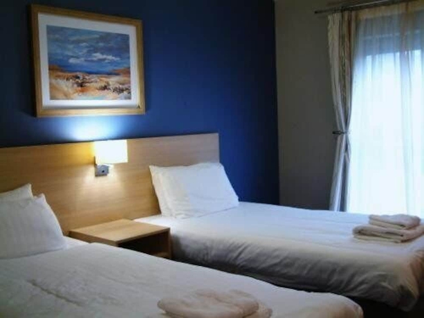 Imagen de la habitación del Hotel The Welcome Inn. Foto 5