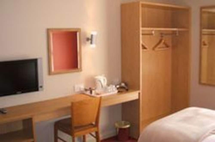 Imagen de la habitación del Hotel The Welcome Inn. Foto 6