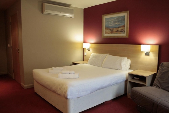 Imagen de la habitación del Hotel The Welcome Inn. Foto 8