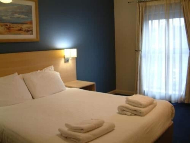 Imagen de la habitación del Hotel The Welcome Inn. Foto 10