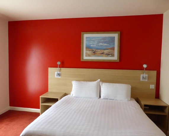 Imagen de la habitación del Hotel The Welcome Inn. Foto 11