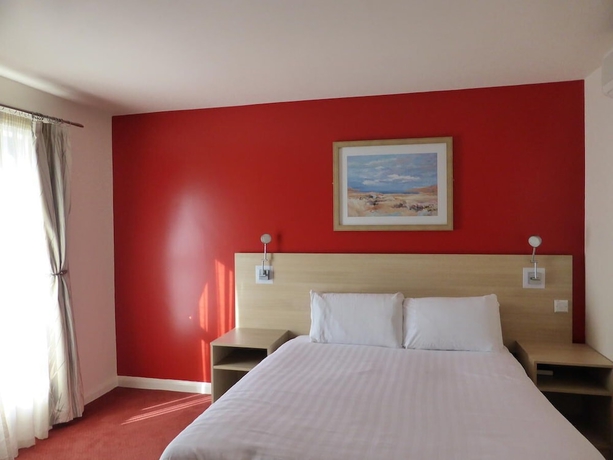 Imagen de la habitación del Hotel The Welcome Inn. Foto 12