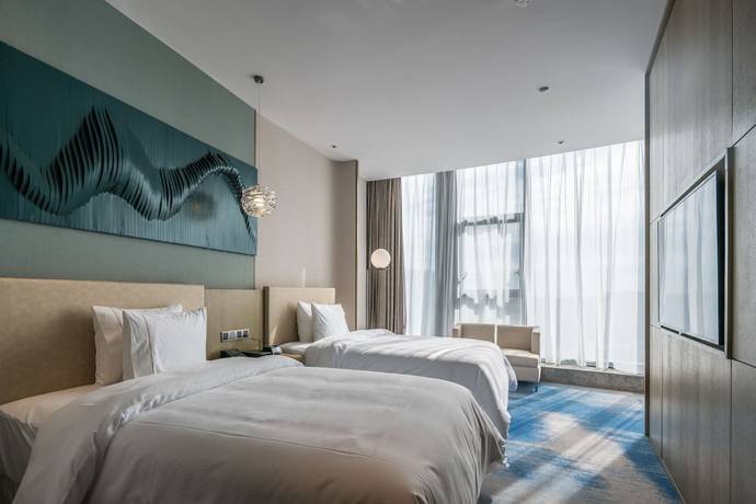 Imagen de la habitación del Hotel The Westin Qingdao West Coast. Foto 15
