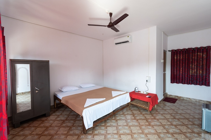 Imagen de la habitación del Hotel The Whispering Lake Resorts. Foto 7