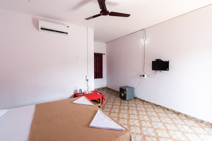 Imagen de la habitación del Hotel The Whispering Lake Resorts. Foto 8