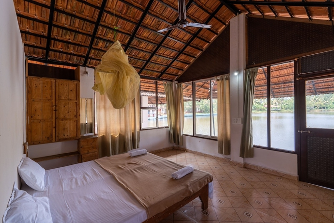 Imagen de la habitación del Hotel The Whispering Lake Resorts. Foto 9