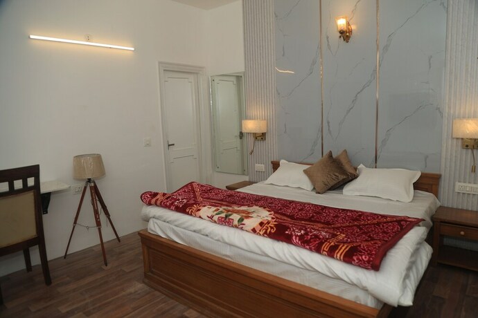 Imagen de la habitación del Hotel The Whispering Pine And Suites. Foto 19