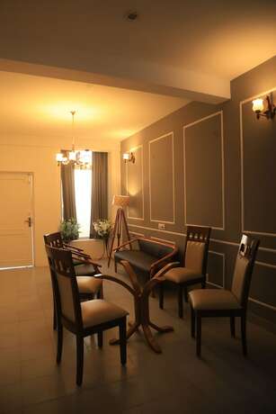 Imagen de la habitación del Hotel The Whispering Pine And Suites. Foto 23