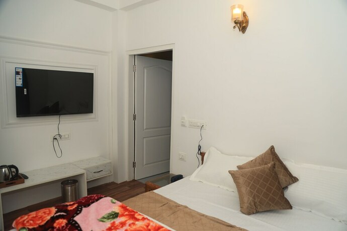 Imagen de la habitación del Hotel The Whispering Pine And Suites. Foto 26