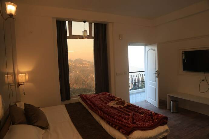 Imagen de la habitación del Hotel The Whispering Pine And Suites. Foto 29