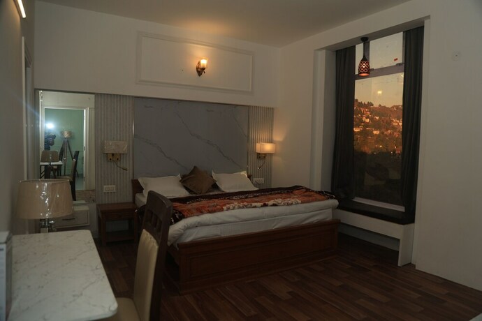 Imagen de la habitación del Hotel The Whispering Pine And Suites. Foto 30