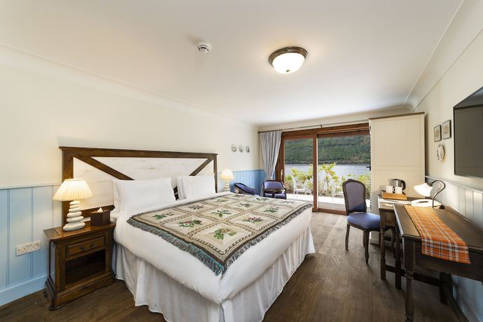 Imagen de la habitación del Hotel The Whispering Pine Lodge. Foto 2