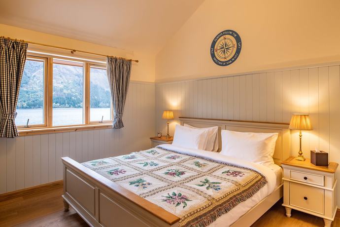 Imagen de la habitación del Hotel The Whispering Pine Lodge. Foto 3