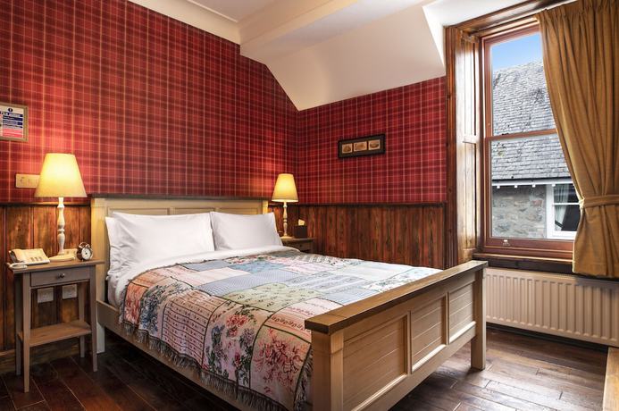 Imagen de la habitación del Hotel The Whispering Pine Lodge. Foto 4