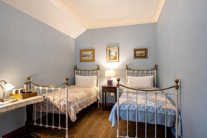 Imagen de la habitación del Hotel The Whispering Pine Lodge. Foto 5