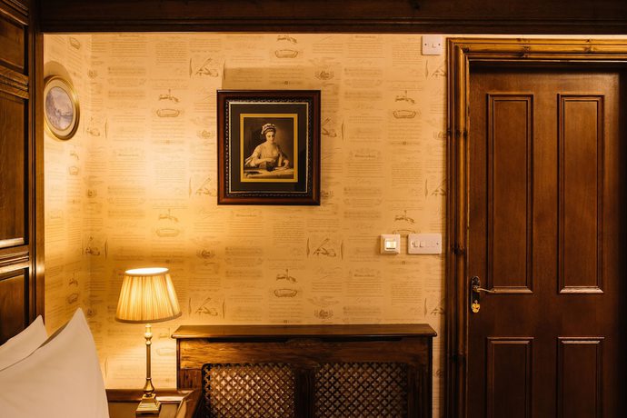 Imagen de la habitación del Hotel The Whispering Pine Lodge. Foto 7