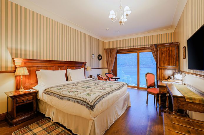 Imagen de la habitación del Hotel The Whispering Pine Lodge. Foto 8