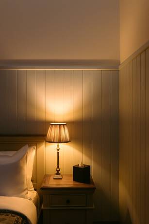 Imagen de la habitación del Hotel The Whispering Pine Lodge. Foto 9