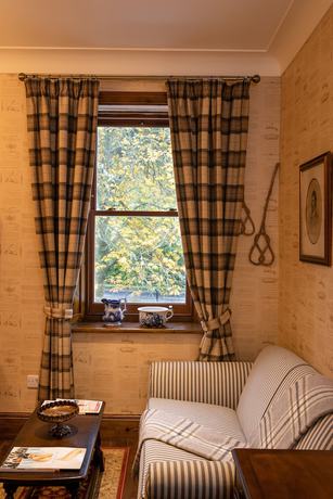 Imagen de la habitación del Hotel The Whispering Pine Lodge. Foto 10