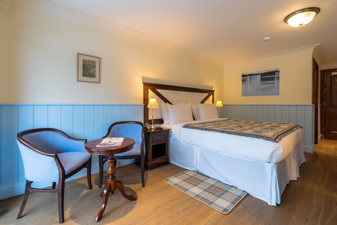 Imagen de la habitación del Hotel The Whispering Pine Lodge. Foto 11