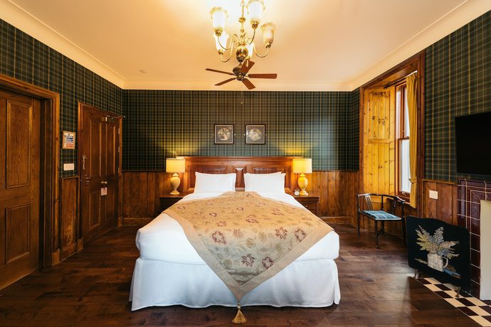 Imagen de la habitación del Hotel The Whispering Pine Lodge. Foto 12