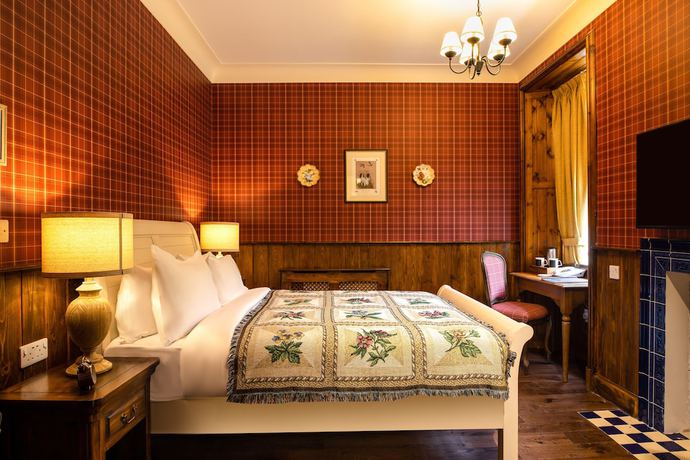 Imagen de la habitación del Hotel The Whispering Pine Lodge. Foto 16