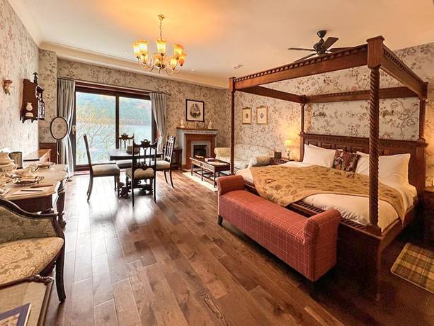 Imagen de la habitación del Hotel The Whispering Pine Lodge. Foto 17