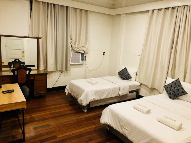 Imagen de la habitación del Hotel The White BandB Bacolod. Foto 15
