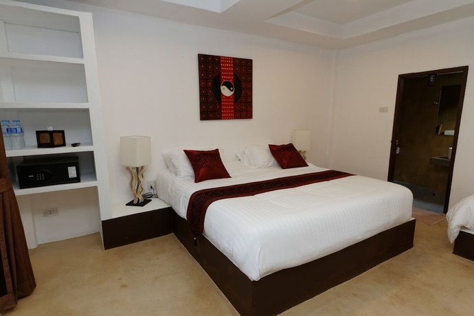 Imagen de la habitación del Hotel The White Cottage. Foto 8