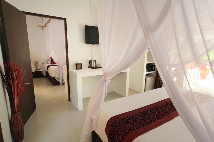 Imagen de la habitación del Hotel The White Cottage. Foto 11