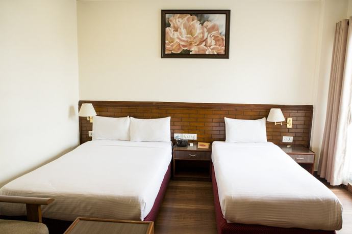 Imagen de la habitación del Hotel The White Lotus View. Foto 8