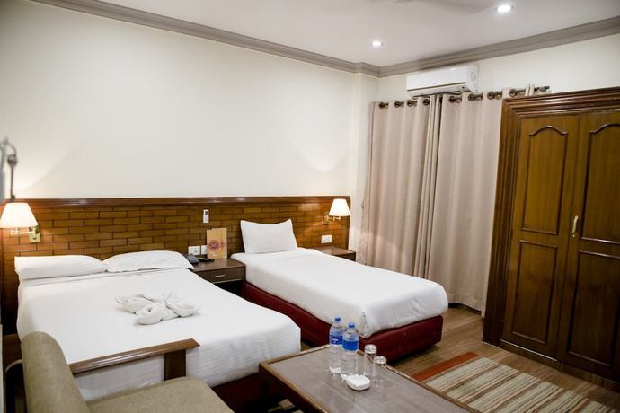 Imagen de la habitación del Hotel The White Lotus View. Foto 11