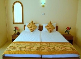 Imagen de la habitación del Hotel The White Orchid Resort. Foto 6