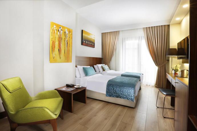 Imagen de la habitación del Hotel The White Orient. Foto 8