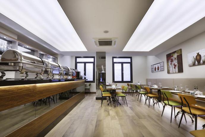 Imagen del bar/restaurante del Hotel The White Orient. Foto 4