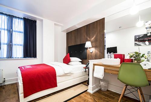 Imagen de la habitación del Hotel The Whitechapel. Foto 2