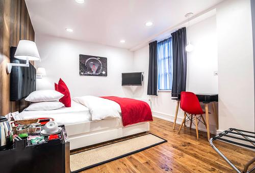Imagen de la habitación del Hotel The Whitechapel. Foto 6