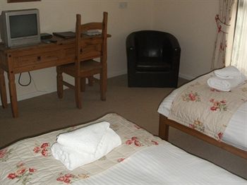 Imagen de la habitación del Hotel The Whitehouse Inn. Foto 3