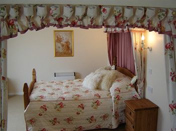 Imagen de la habitación del Hotel The Whitehouse Inn. Foto 4