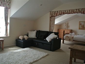 Imagen de la habitación del Hotel The Whitehouse Inn. Foto 5