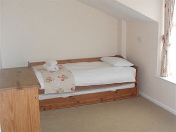 Imagen de la habitación del Hotel The Whitehouse Inn. Foto 6