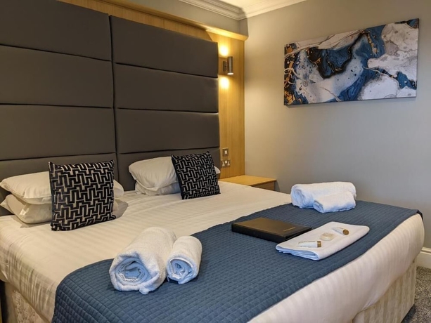 Imagen de la habitación del Hotel The Wildings. Foto 2