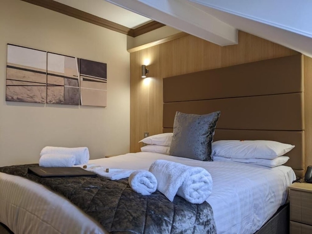 Imagen de la habitación del Hotel The Wildings. Foto 6