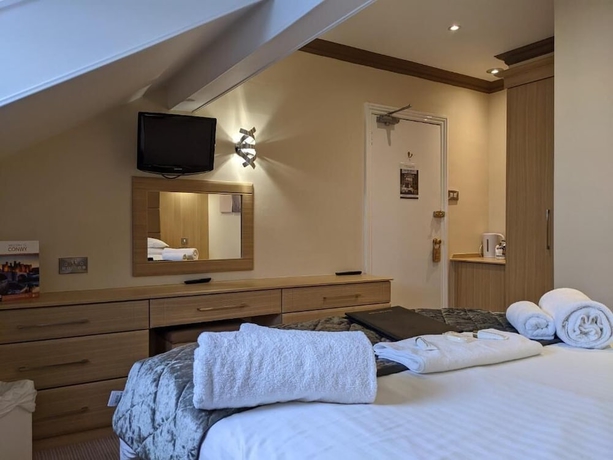 Imagen de la habitación del Hotel The Wildings. Foto 7