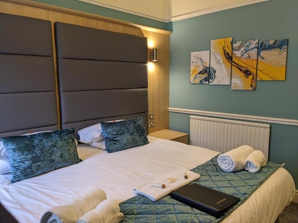 Imagen de la habitación del Hotel The Wildings. Foto 10