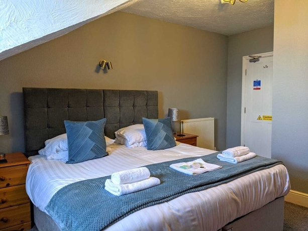 Imagen de la habitación del Hotel The Wildings. Foto 15
